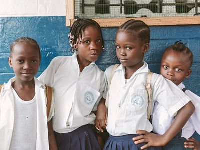 Children in a white shirt.