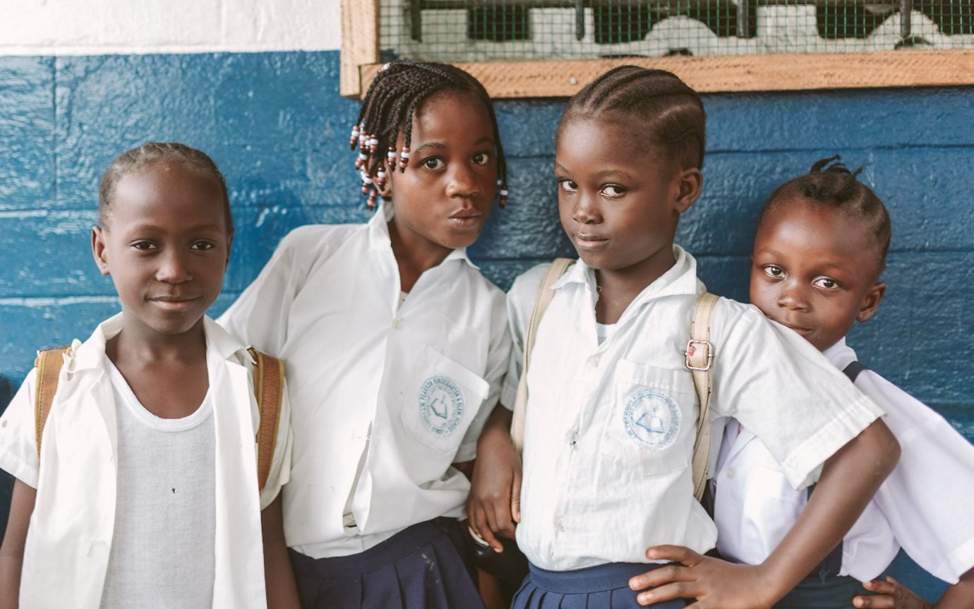 Children in a white shirt.