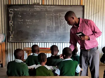 BIA, Teacher with students in classroom